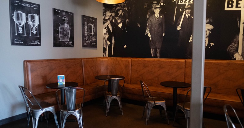Leather booths in the corner, walls decorated with photographs