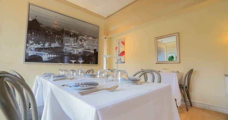 Interior, dining area with table set for guests