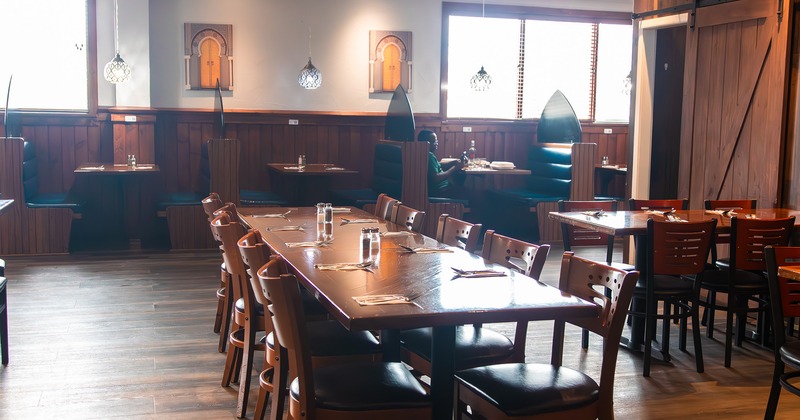 Interior, dining area, tables ready for guests