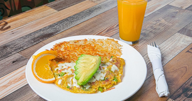 Vegetarian and Cheddar Cheese Omelet, with avocado, and hashbrowns