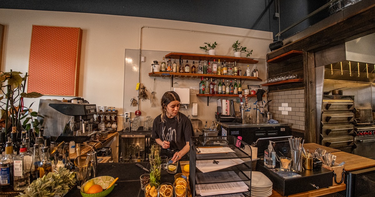 Bar, bartender preparing cocktail, coffee machine