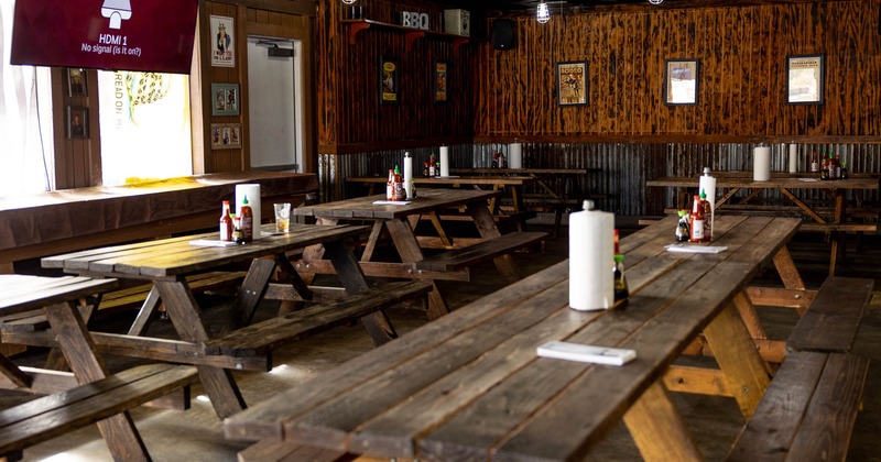 Interior, wooden tables and benches lined up