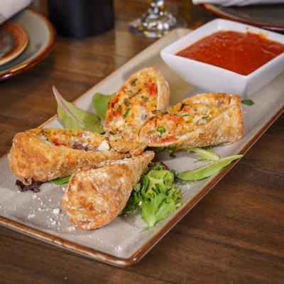 Italian egg rolls served with marinara sauce.
