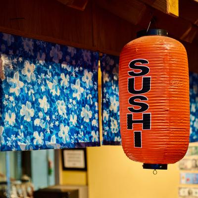 Red cylindrical Japanese paper lantern.