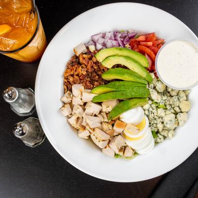 Docks cobb salad served with an iced drink.