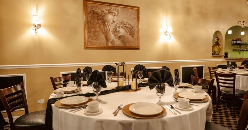 Elegantly set dining table with white tablecloth