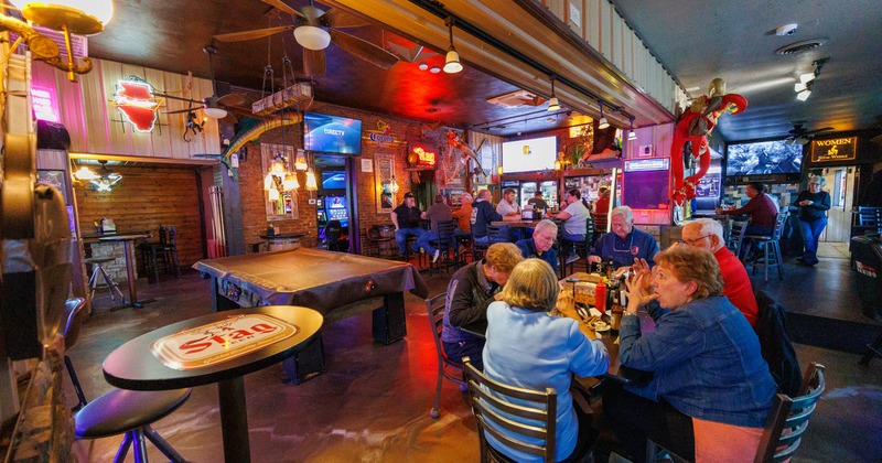 Interior, dining area with neon signs
