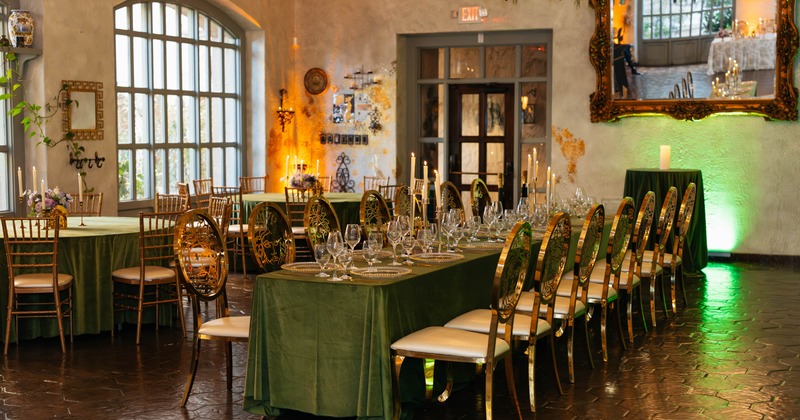 Interior, seating area, long table for fourteen people, round tables for ten in the back