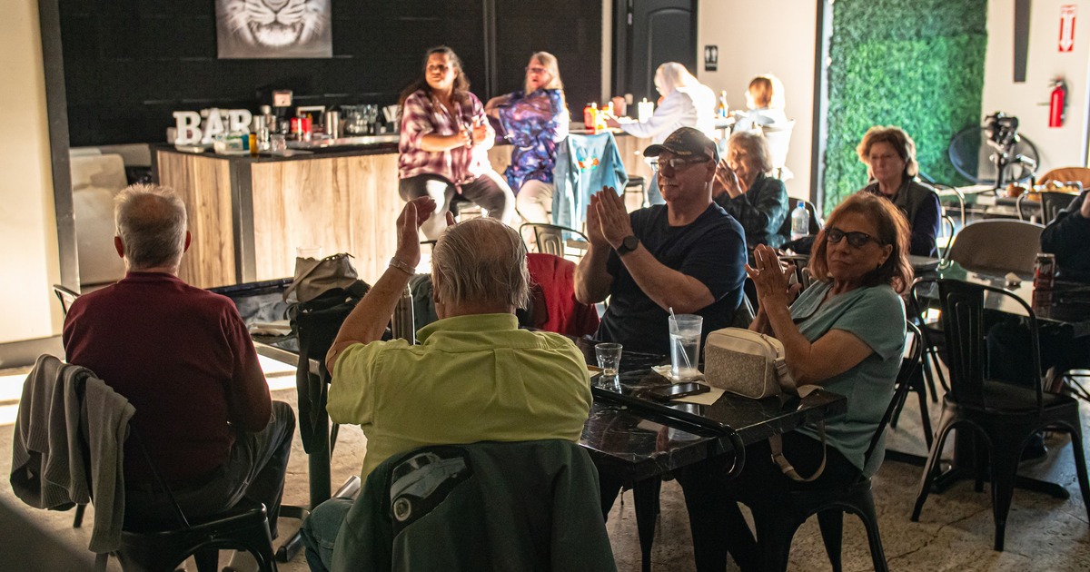 Guests cheering at the table