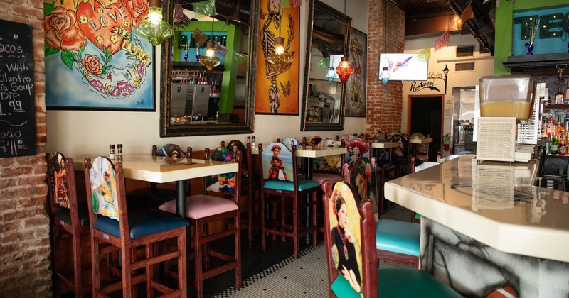 Interior, seating area with tables, chairs and wall decorations