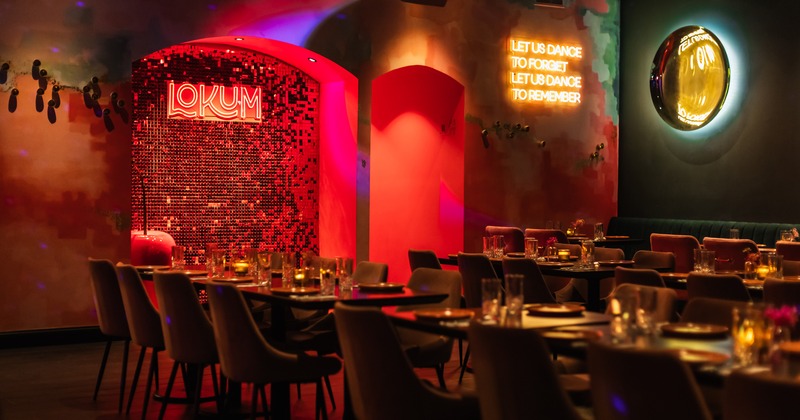 Modern and cozy restaurant interior dining area with set tables