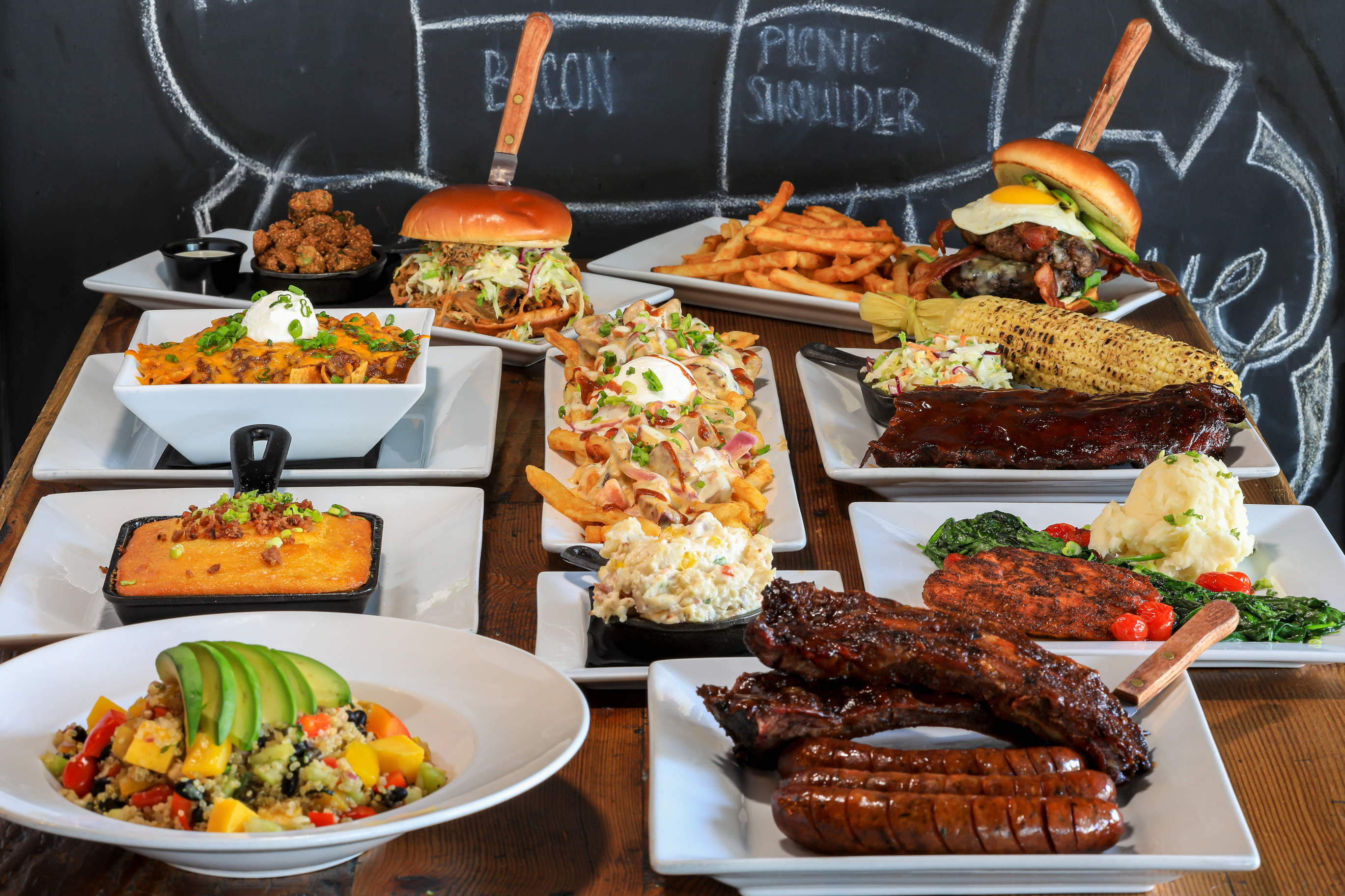 Different menu items, showing our meats and appetisers,pitmaster fries and burgers, sandwiches and salads