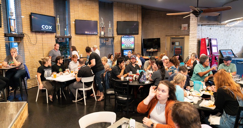 Interior space, dining area full of guests enjoying their food