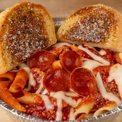 Penne pasta, with tomato sauce, melted cheese, pepperoni, and garlic toast.