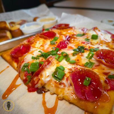 Hot oney pepperoni pizza, closeup.