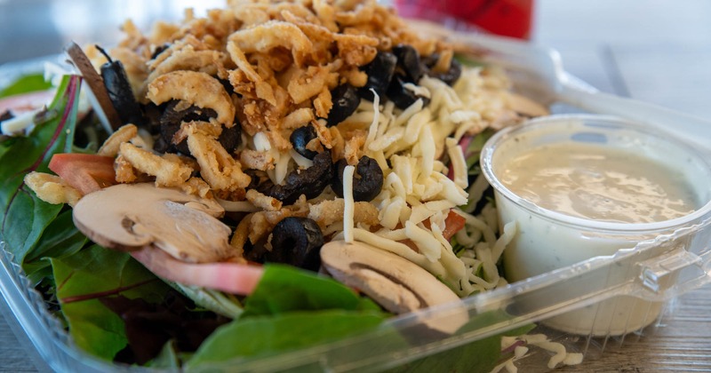 Loaded fries with, cheddar, bacon, and jalapenos