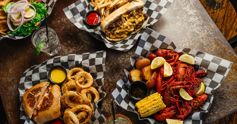 Various dishes served on the table with cocktails
