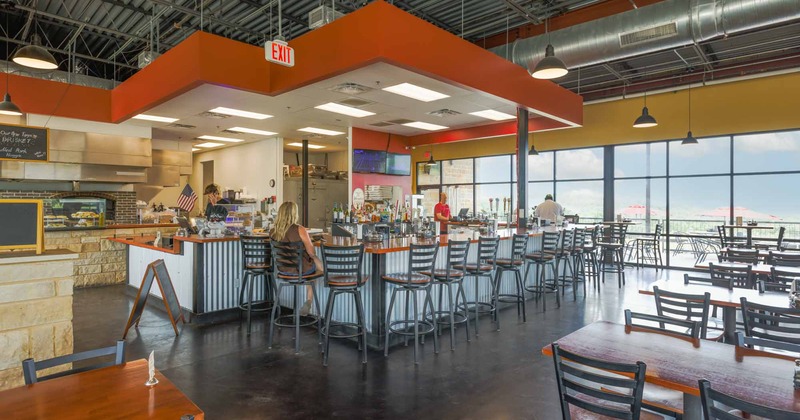 Employees and customers in bar area