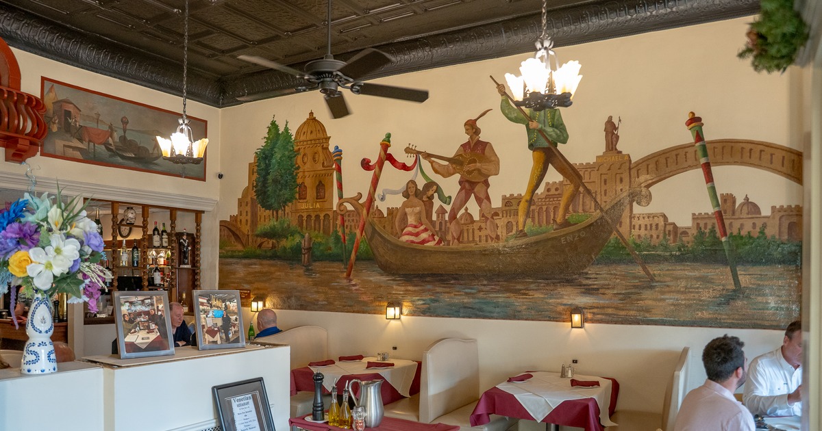 Diner area, tables, decorated wall