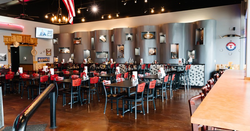Spacious and cozy interior dining area with tables ready for guests