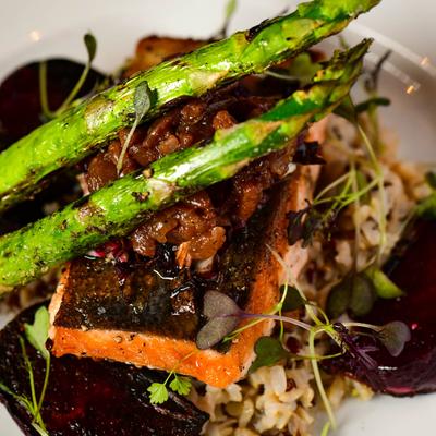 Arctic char served with rice and asparagus, close up.