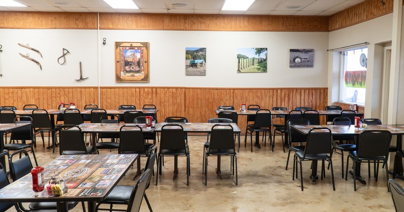 Cozy interior dining area with dining tables ready for guests