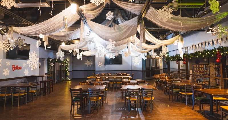 Interior, upstairs private dining area, tables and chairs, winter decorations on the ceiling