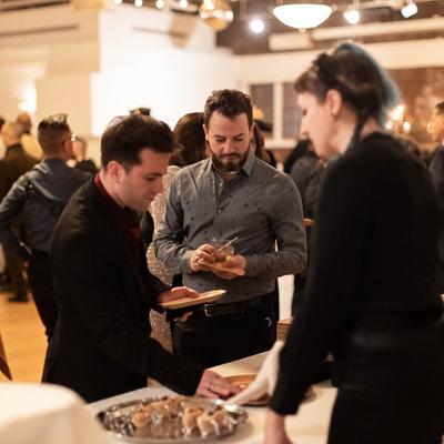 Guests at a buffet table.