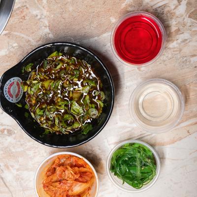 Vegetable soup and side condiments.