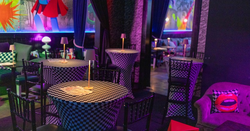 Interior, high seating tables with stools, checkered black and white cloth