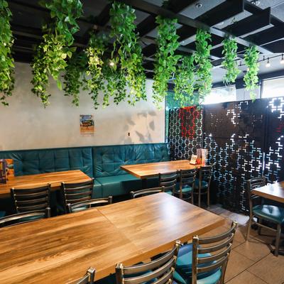 Interior, tables, seating, plants.