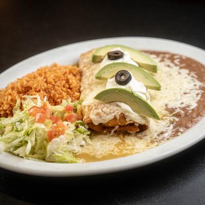 Chimichanga burrito with refried beans, Mexican rice, and salad.