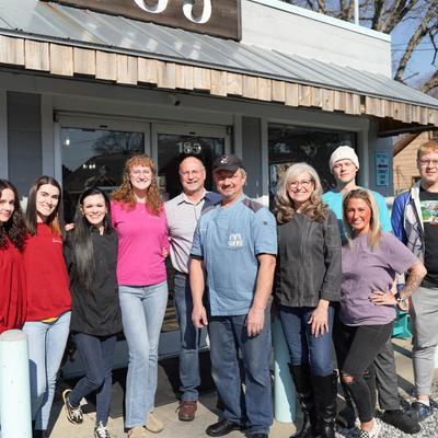 The owners posing with their staff.