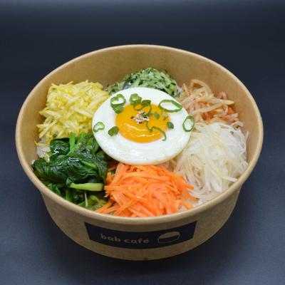 Rice bowl with mixed veggies and fried egg.