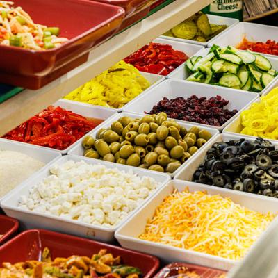 Salad bar featuring a wide variety of fresh toppings.