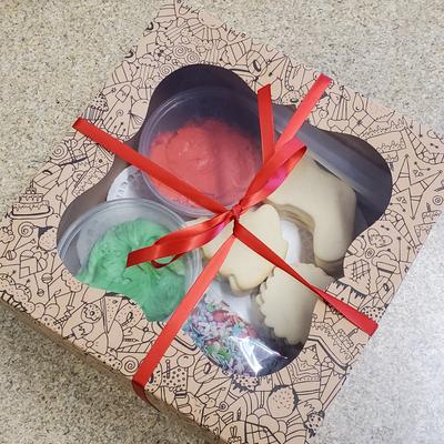 Cookie gift box with a red ribbon.