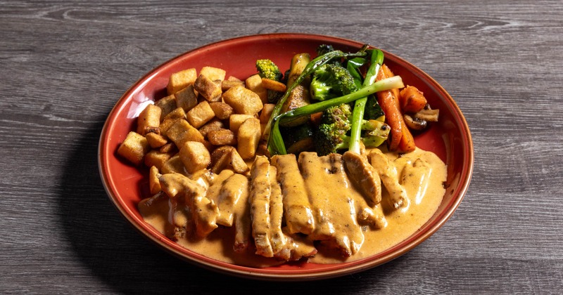 Creamy Chipotle Chicken served with grilled veggies and country potatoes