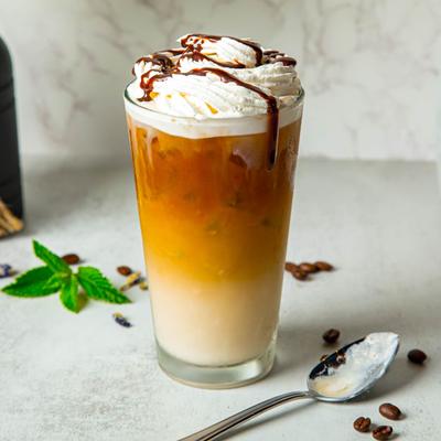 Iced latte with whipped cream.