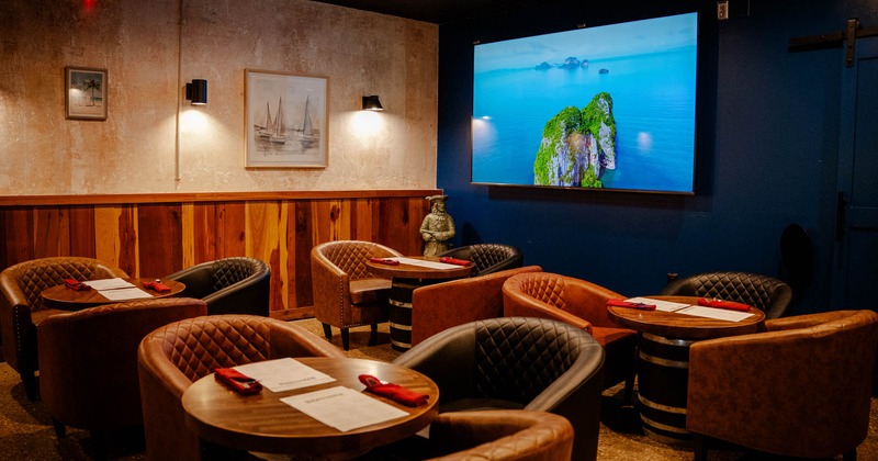 Interior, leather armchairs and round tables