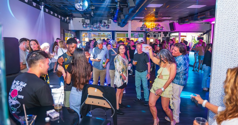 Night club atmosphere, a crowd of people dancing in euphoria