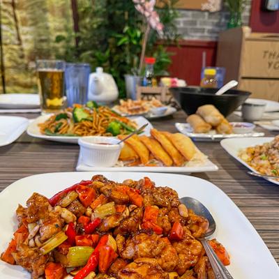 Multiple food plates on the table, side view