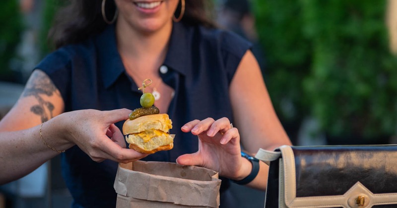 Interior, high seating area, bar with stools, large shop window, various decoration