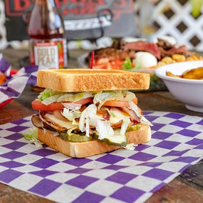 Grilled Club Sandwich alongside other menu items.