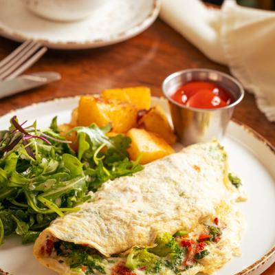 Southwest Omelet with arugula salad and brown butter potatoes.