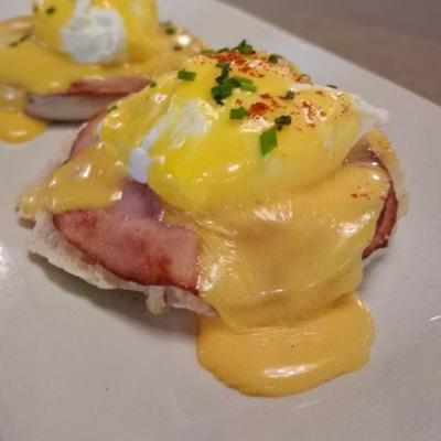 Egg Benedict with Canadian bacon and hollandaise sauce.