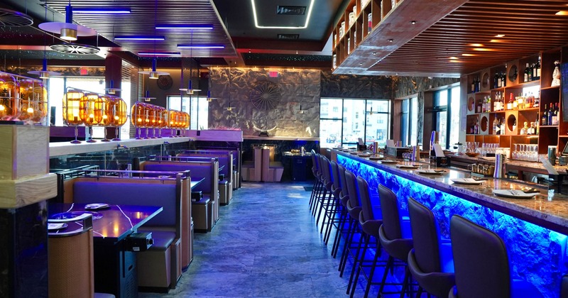 Interior, seating area with a bar on the right