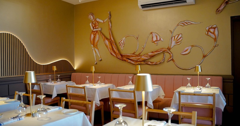 Interior, seating area with booths, tables and chairs