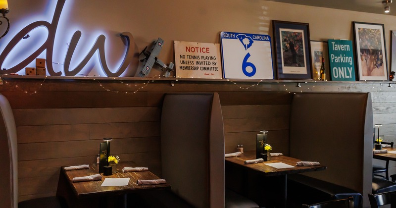 Modern and cozy interior space, dining booths with set tables