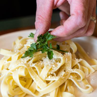 Fettuccine pasta, with sprinkled parmesan