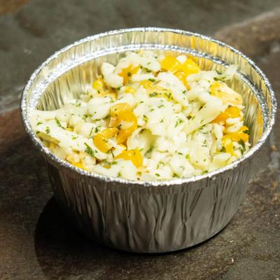 Corn cheese served a in small aliminium bowl.